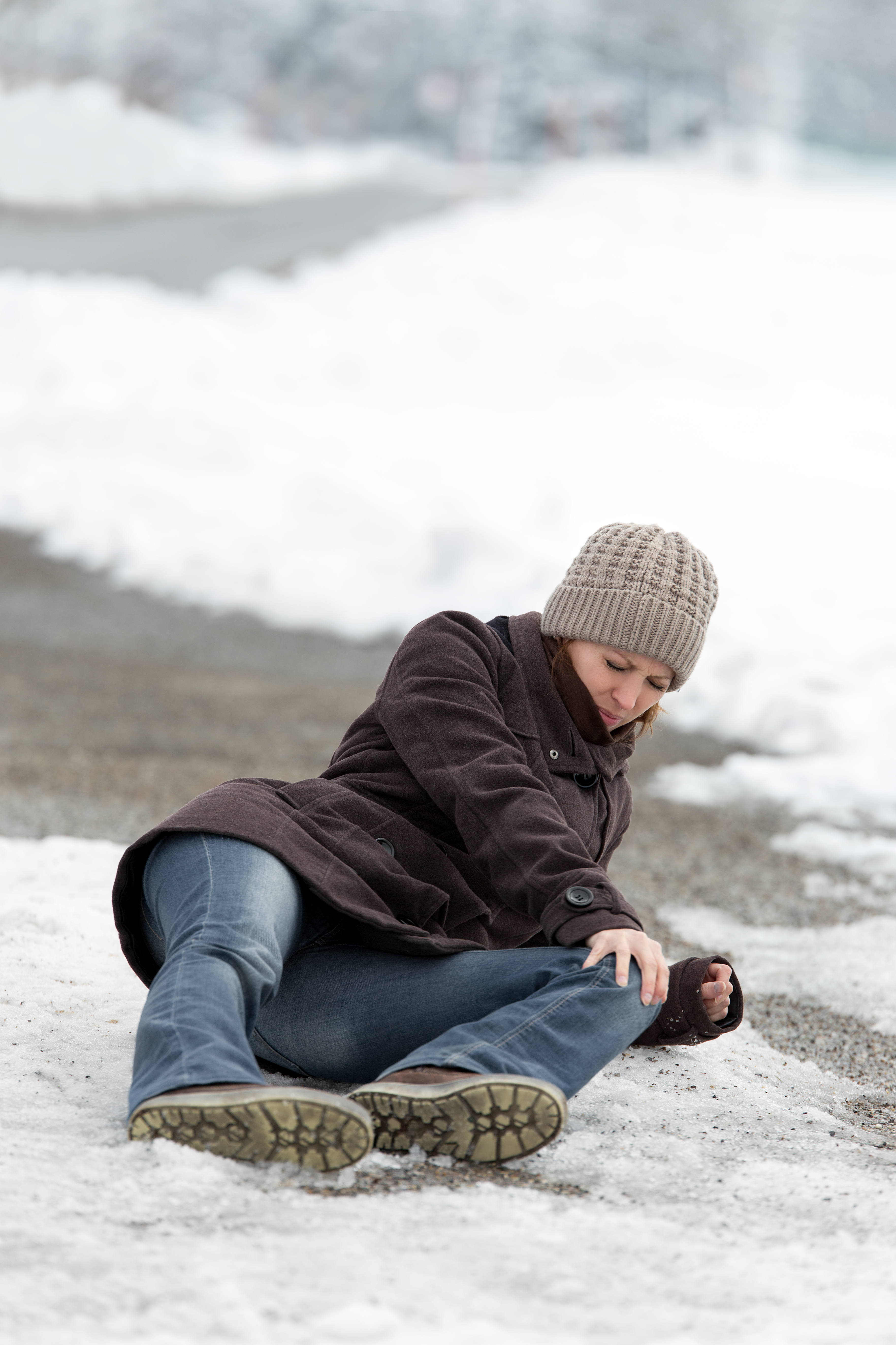 young woman with a accident on a icy street